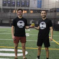 Students wearing championship shirts from a spikeball tournament on Tuesday